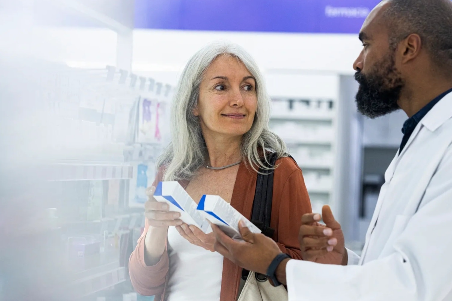 Pharmacist consulting with a patient